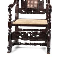 A William and Mary Swan-and-Leaf Carved and Cane Upholstered Oak Armchair