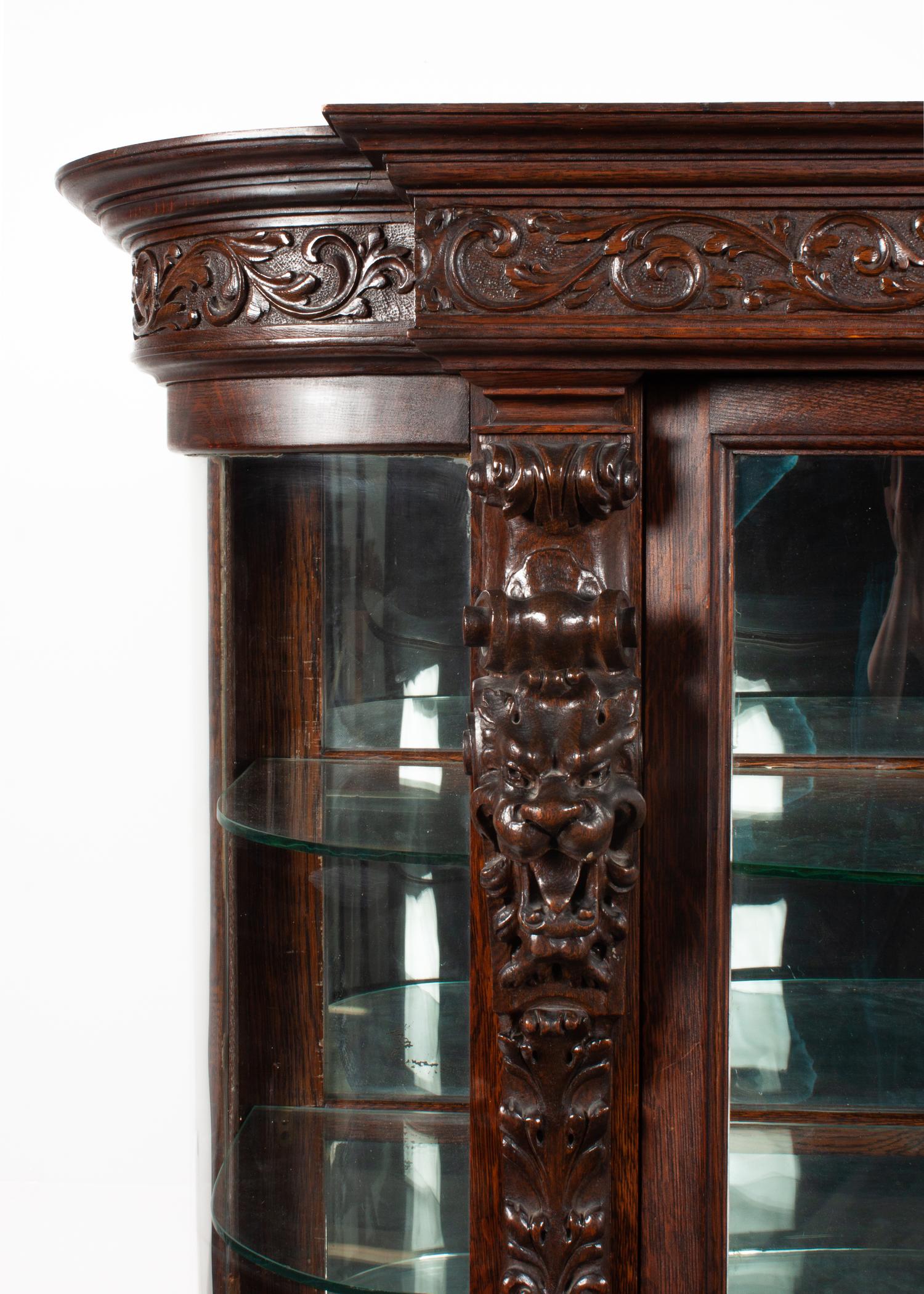 A Renaissance Revival Carved Oak Vitrine