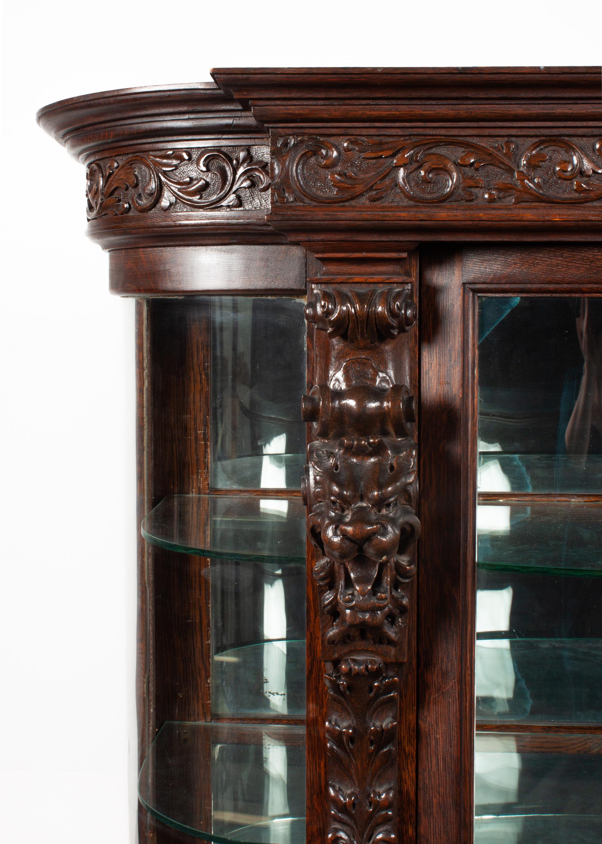 A Renaissance Revival Carved Oak Vitrine