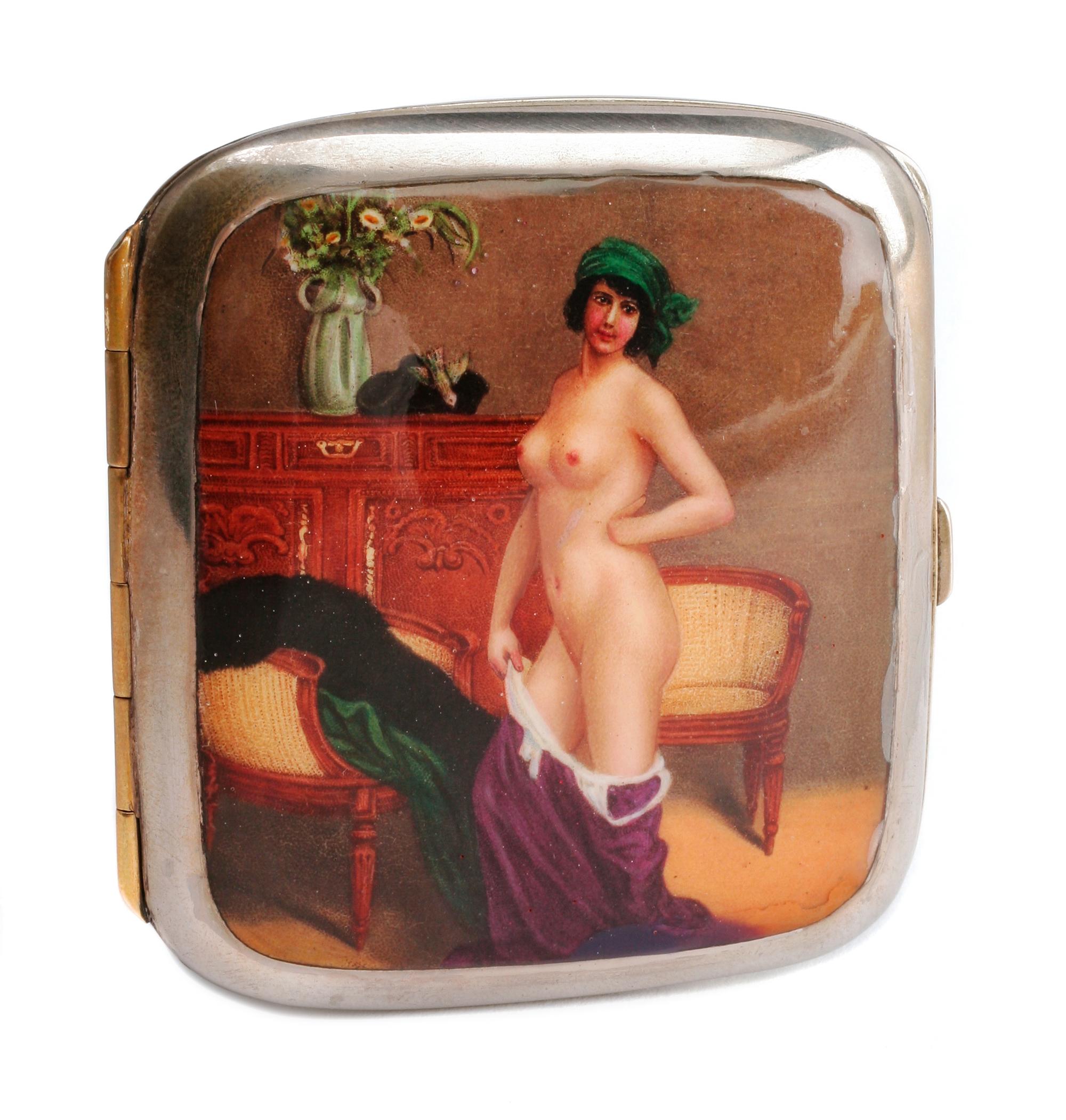 A German Enameled Silver Cigarette Case, Late 19th/Early 20th Century, the lid decorated with a female figure posing in a state of undr