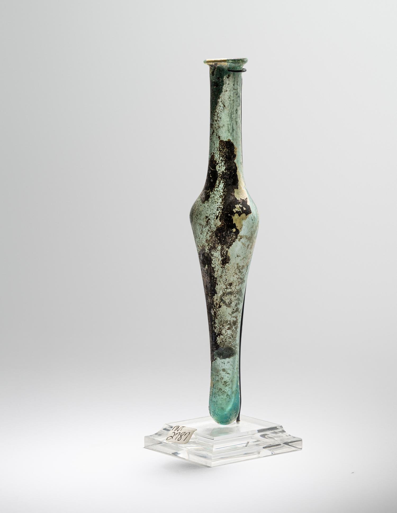 A Roman Pale Blue Glass Unguentarium