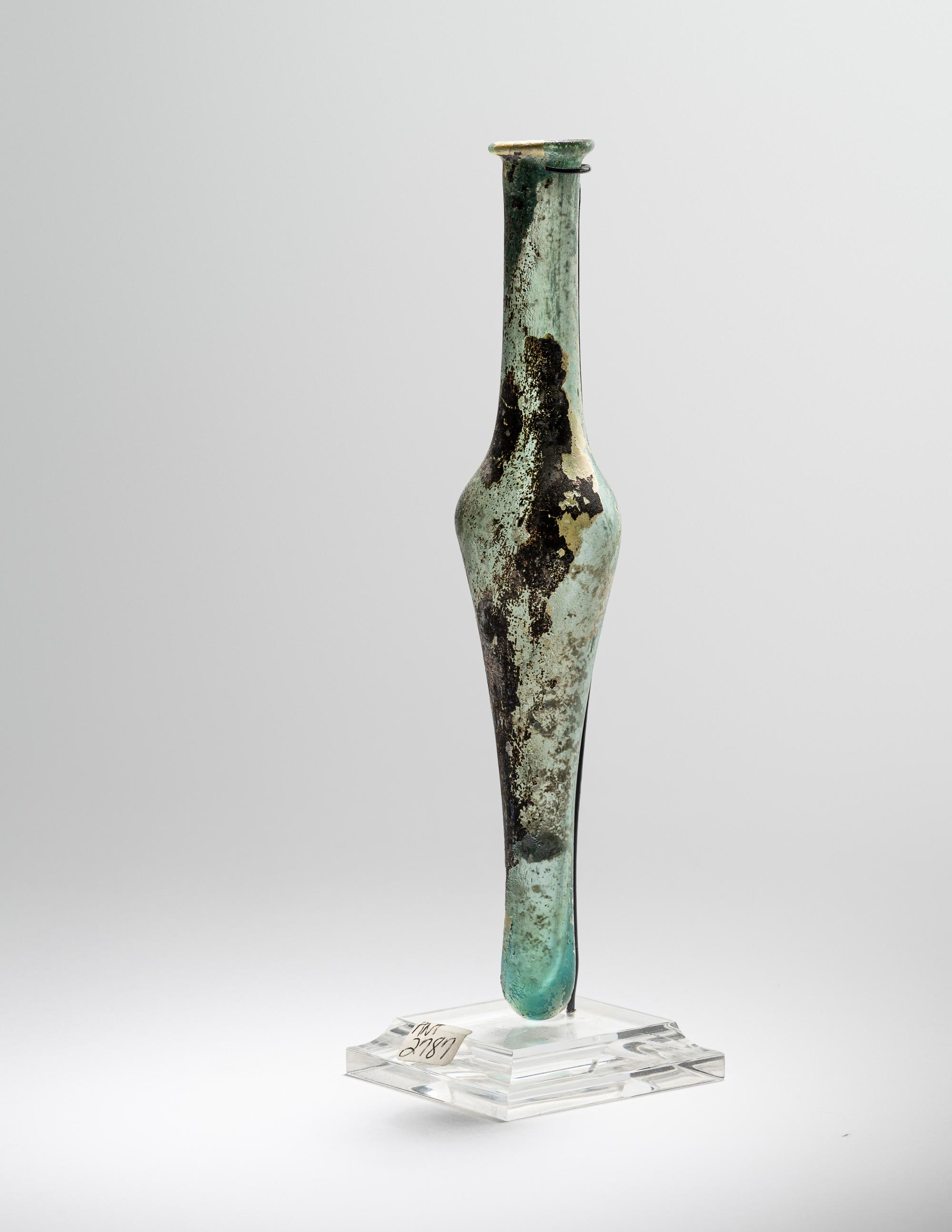 A Roman Pale Blue Glass Unguentarium