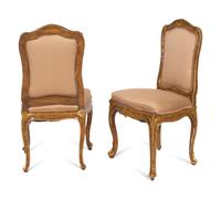 A Set of Four Louis XV Style Painted and Parcel Gilt Dining Chairs