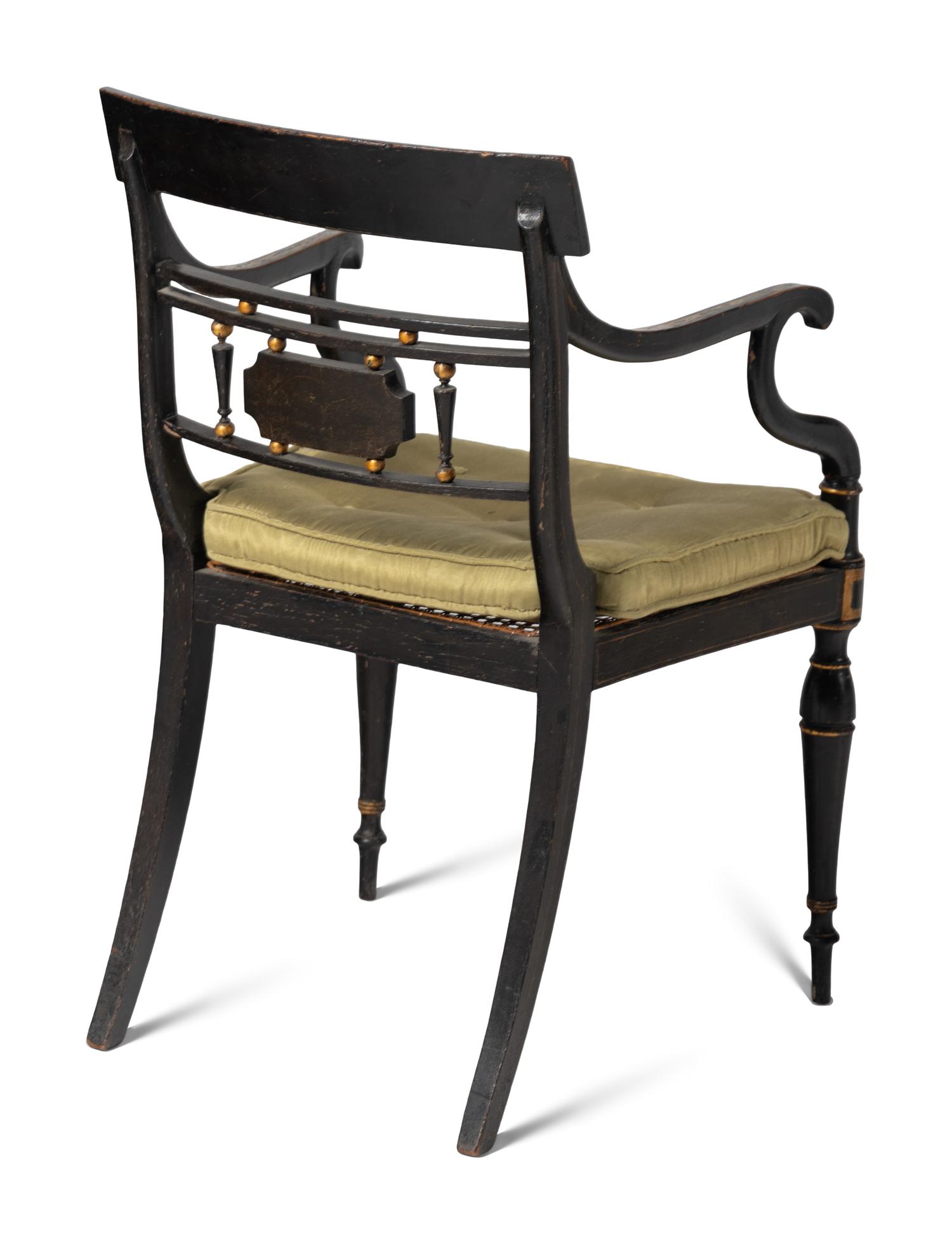 A Set of Four Regency Style Paint Decorated Cane-Seat Armchairs