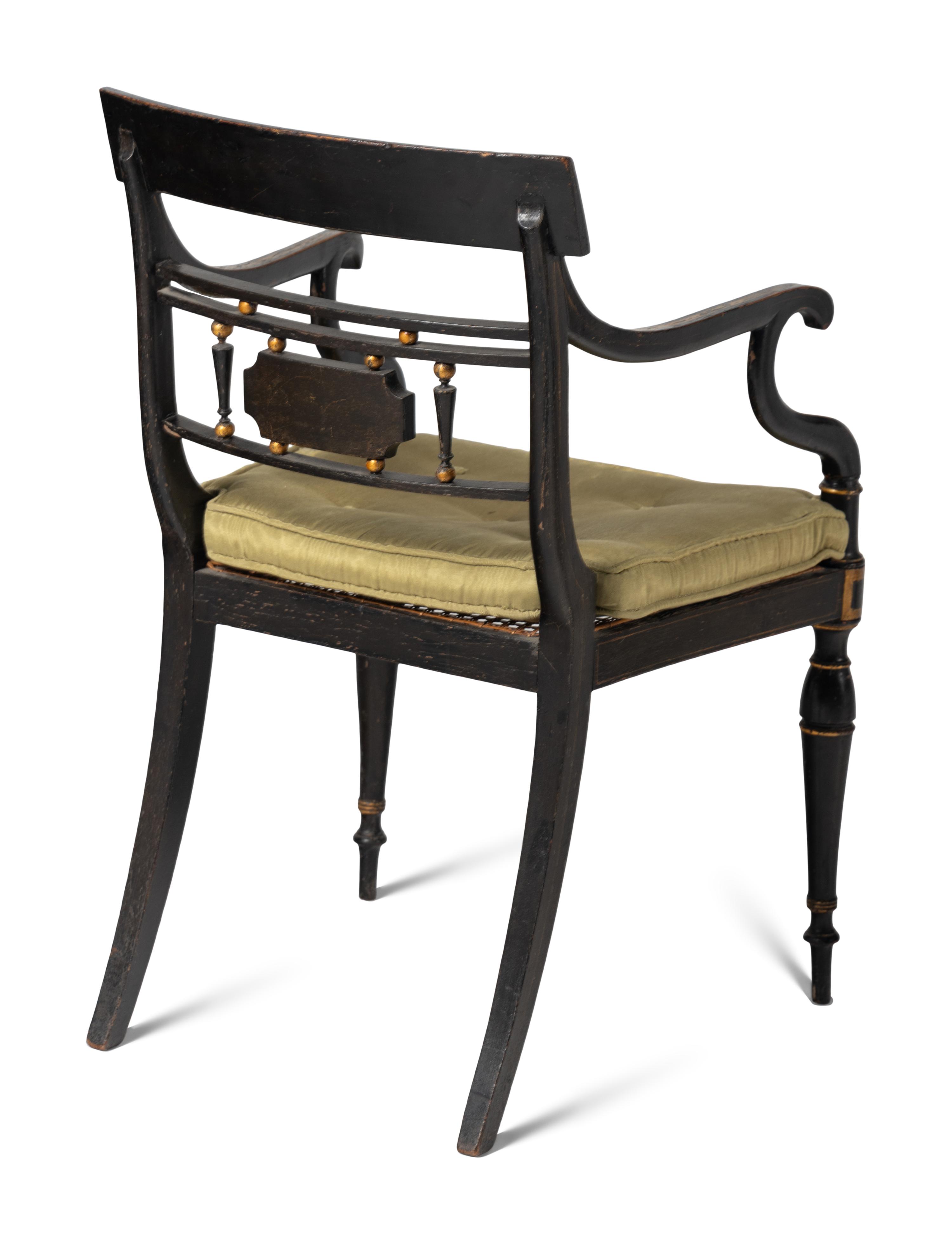 A Set of Four Regency Style Paint Decorated Cane-Seat Armchairs