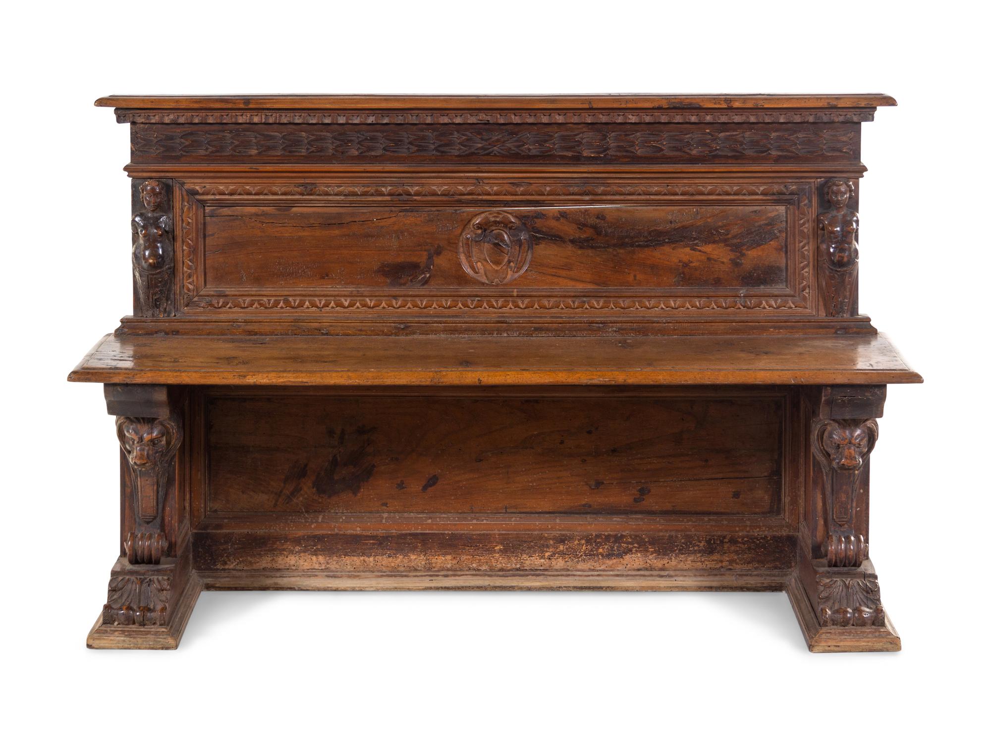 An Italian Renaissance Revival Carved Walnut Hall Bench