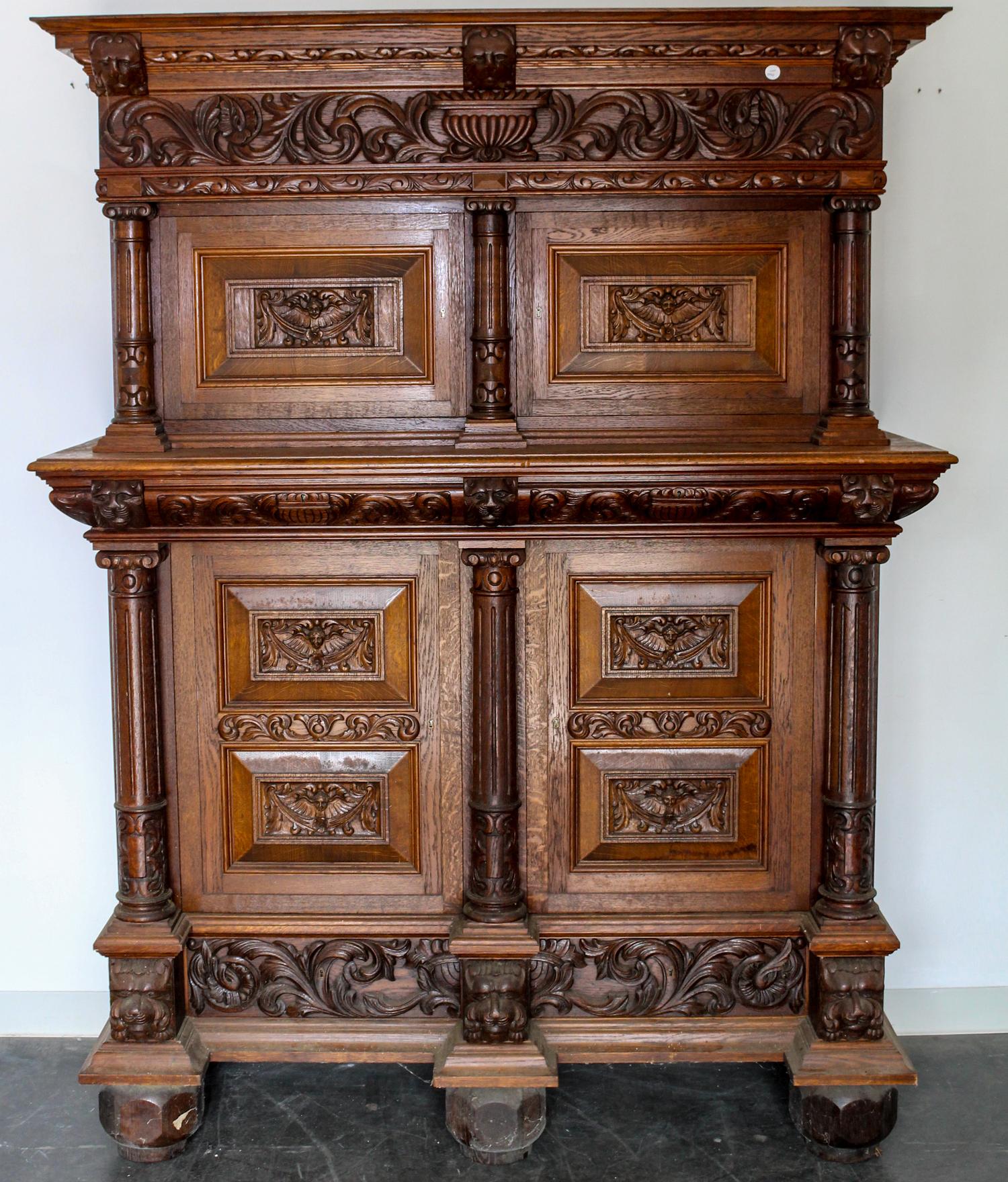 A Continental Carved Oak Wardrobe. Height 81 x width 62 x depth 24 inches.