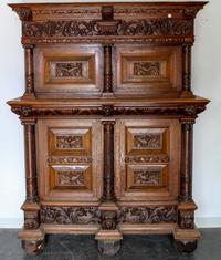A Continental Carved Oak Wardrobe. Height 81 x width 62 x depth 24 inches.
