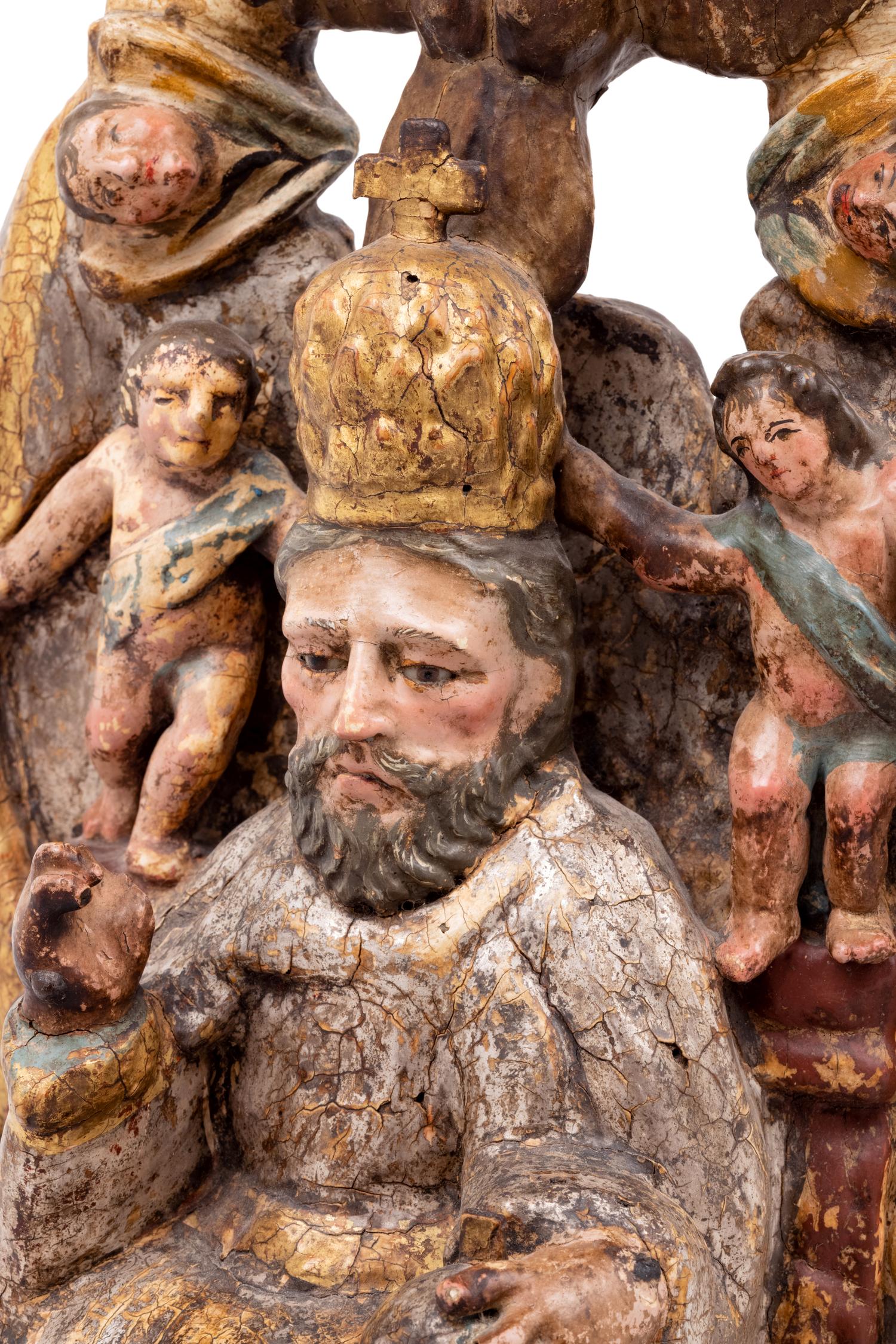 A Spanish Carved and Painted Wood Santos Group