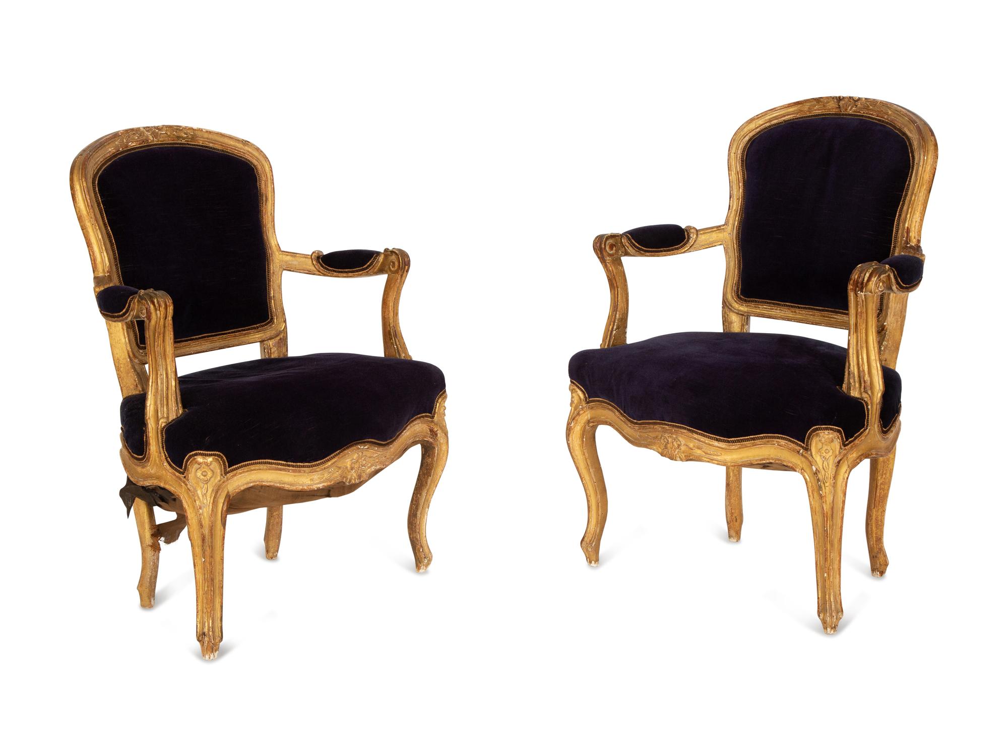 A Pair of Louis XV Giltwood Fauteuils