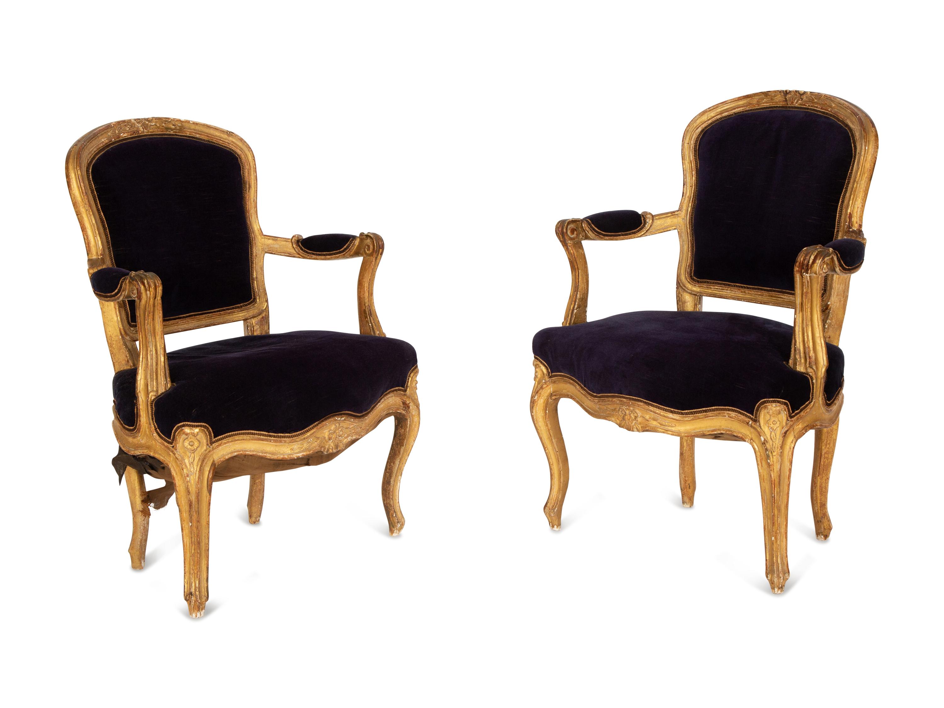 A Pair of Louis XV Giltwood Fauteuils