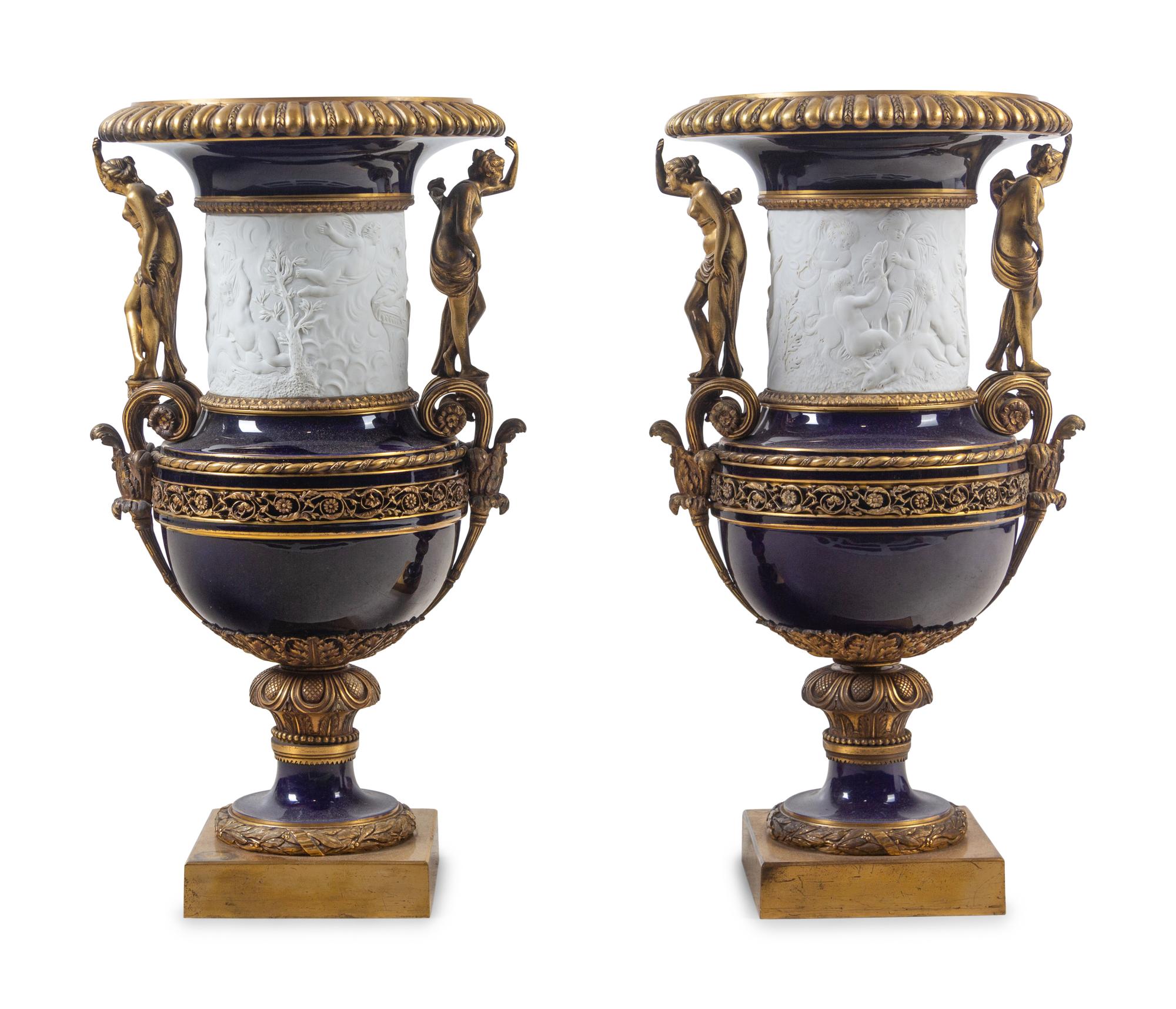 A Pair of French Gilt Bronze Mounted Bisque and Cobalt Glazed Porcelain Urns