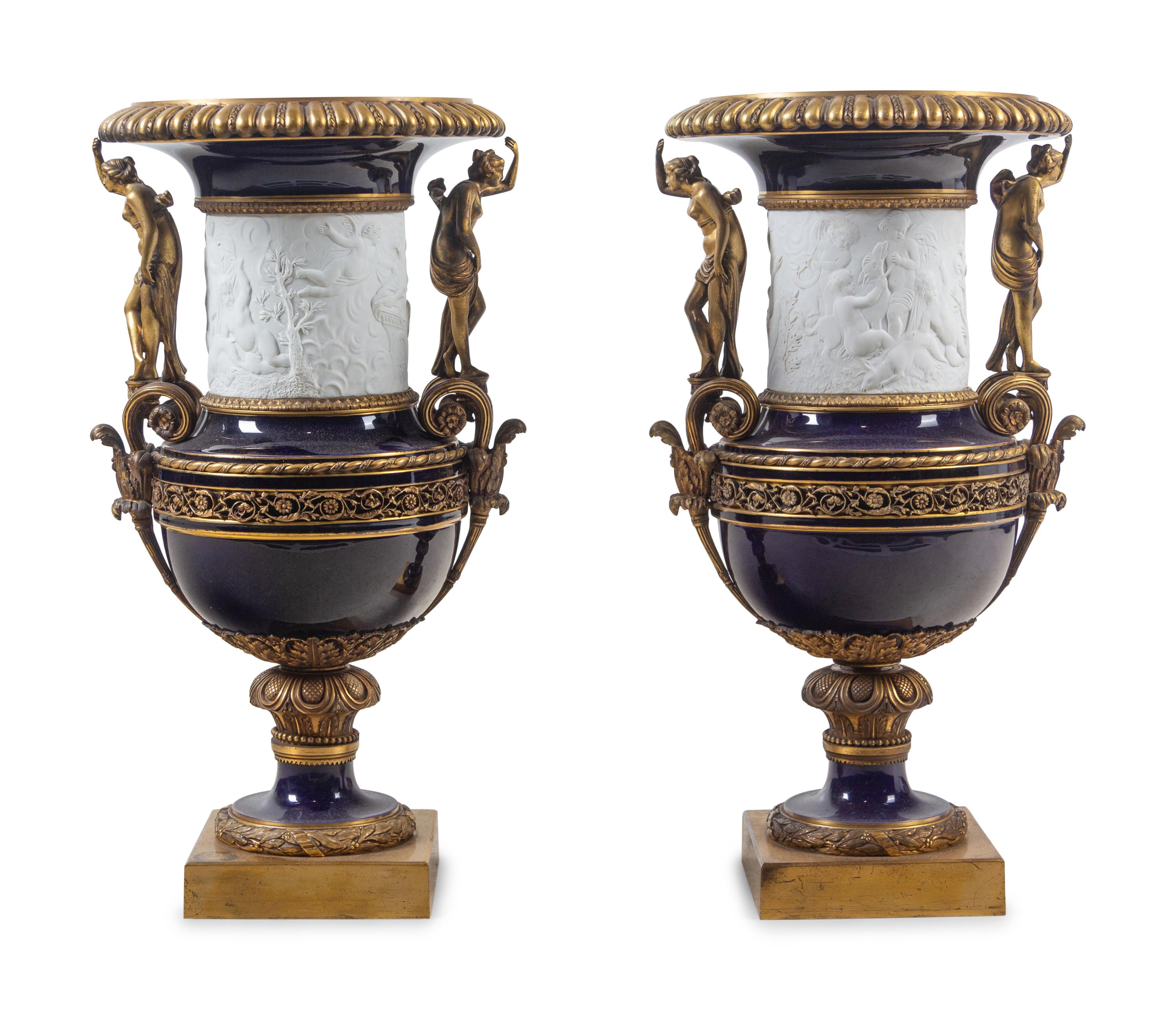 A Pair of French Gilt Bronze Mounted Bisque and Cobalt Glazed Porcelain Urns