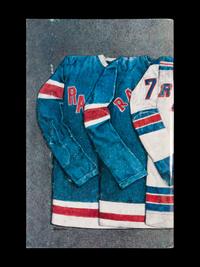 A Group of 16 1960s - 1980s New York Rangers Blue Book Media Guides,