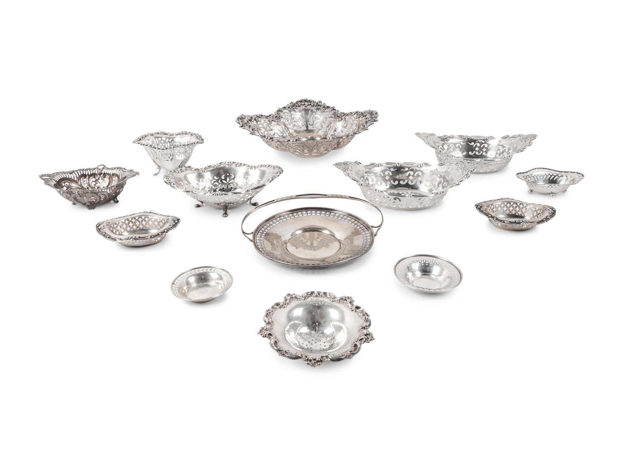A Large Group of American Pierced Silver Dishes