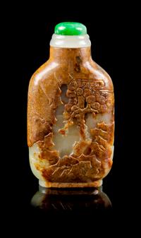 A Carved Celadon and Russet Jade Snuff Bottle Height 2 3/8 inches. — MASTER OF THE ROCKS SCHOOL, 1740-1840