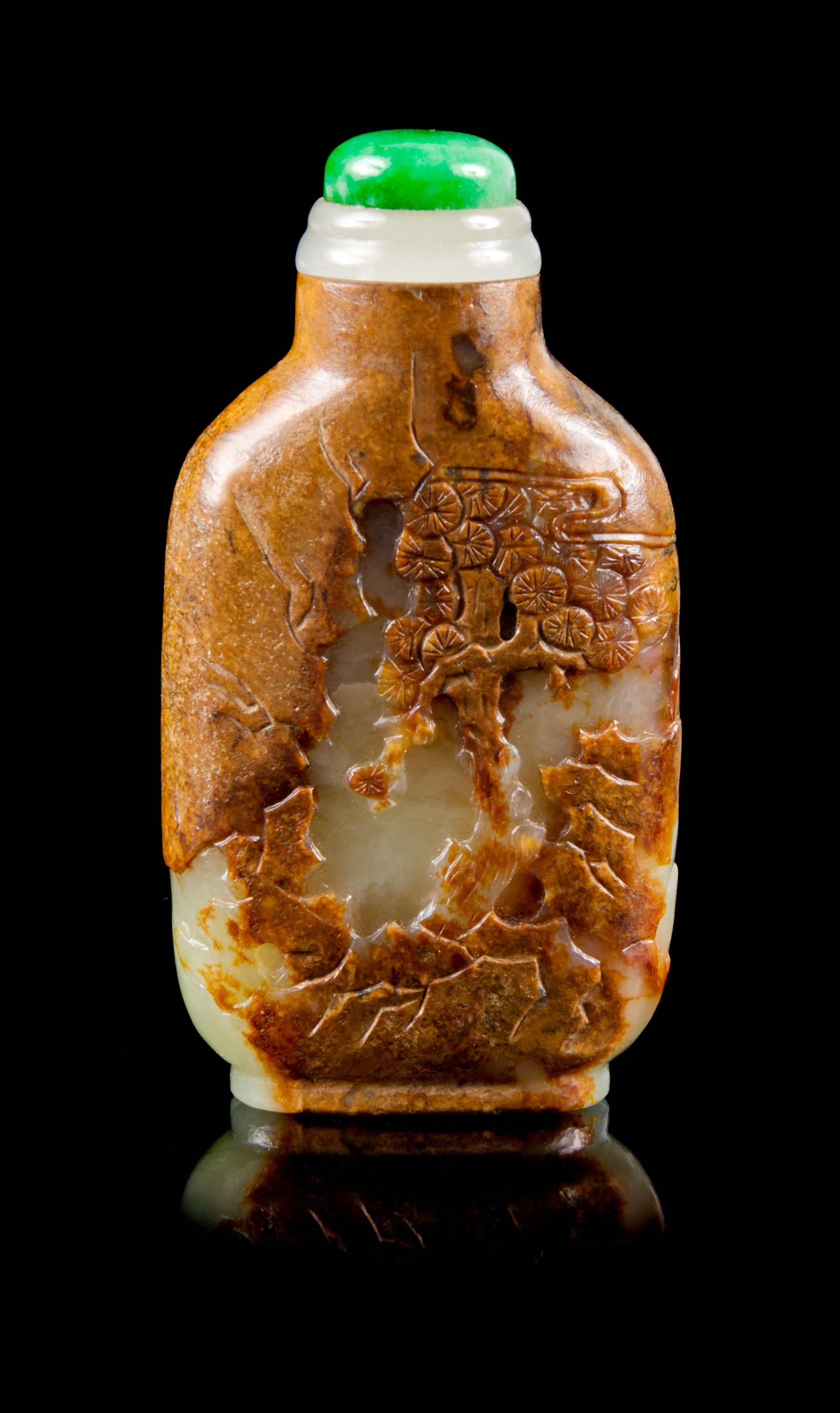 A Carved Celadon and Russet Jade Snuff Bottle Height 2 3/8 inches. — MASTER OF THE ROCKS SCHOOL, 1740-1840