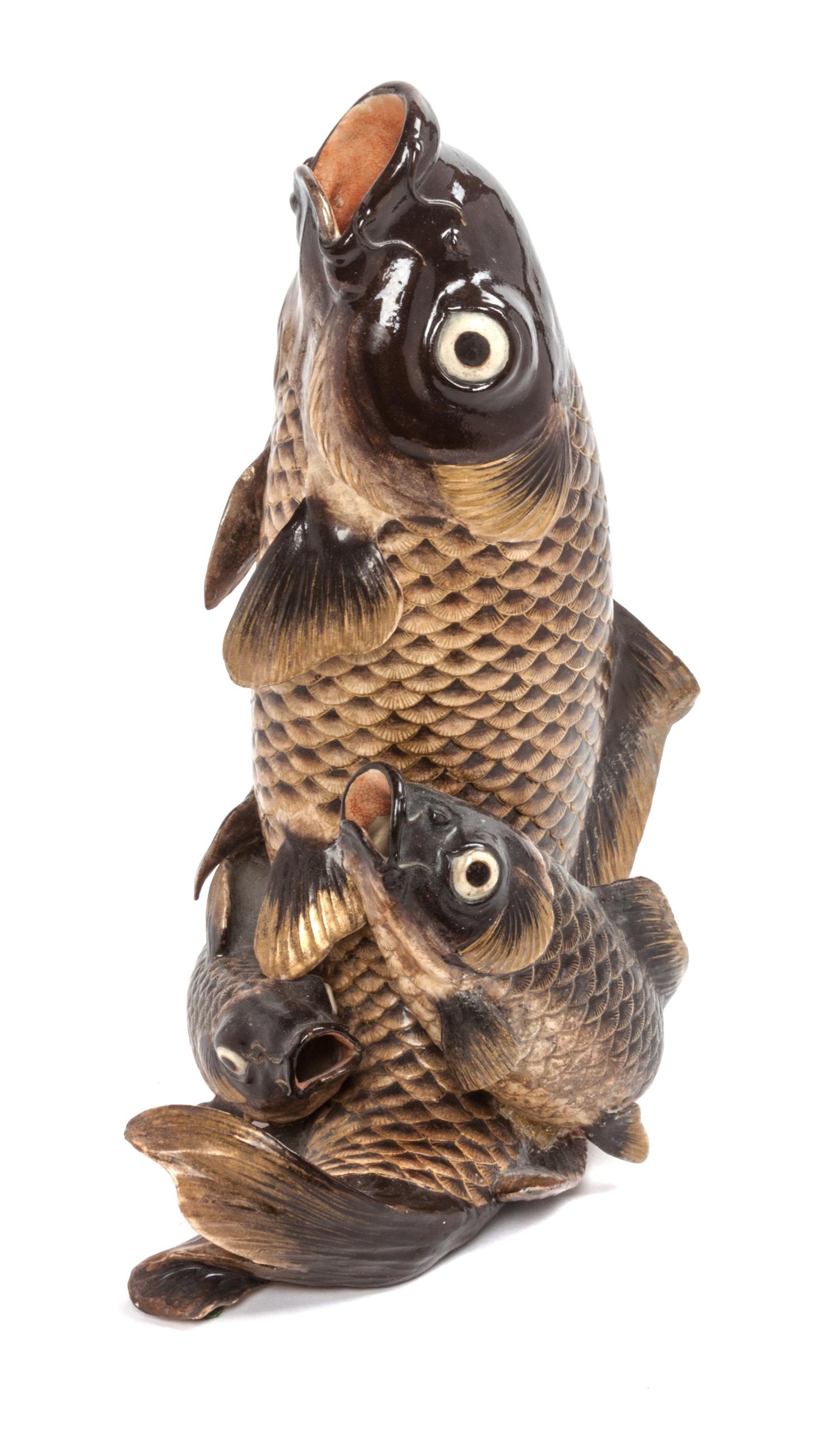A Japanese Gilt Decorated Black Glazed Pottery Figural Group Height 11 1/2 inches.