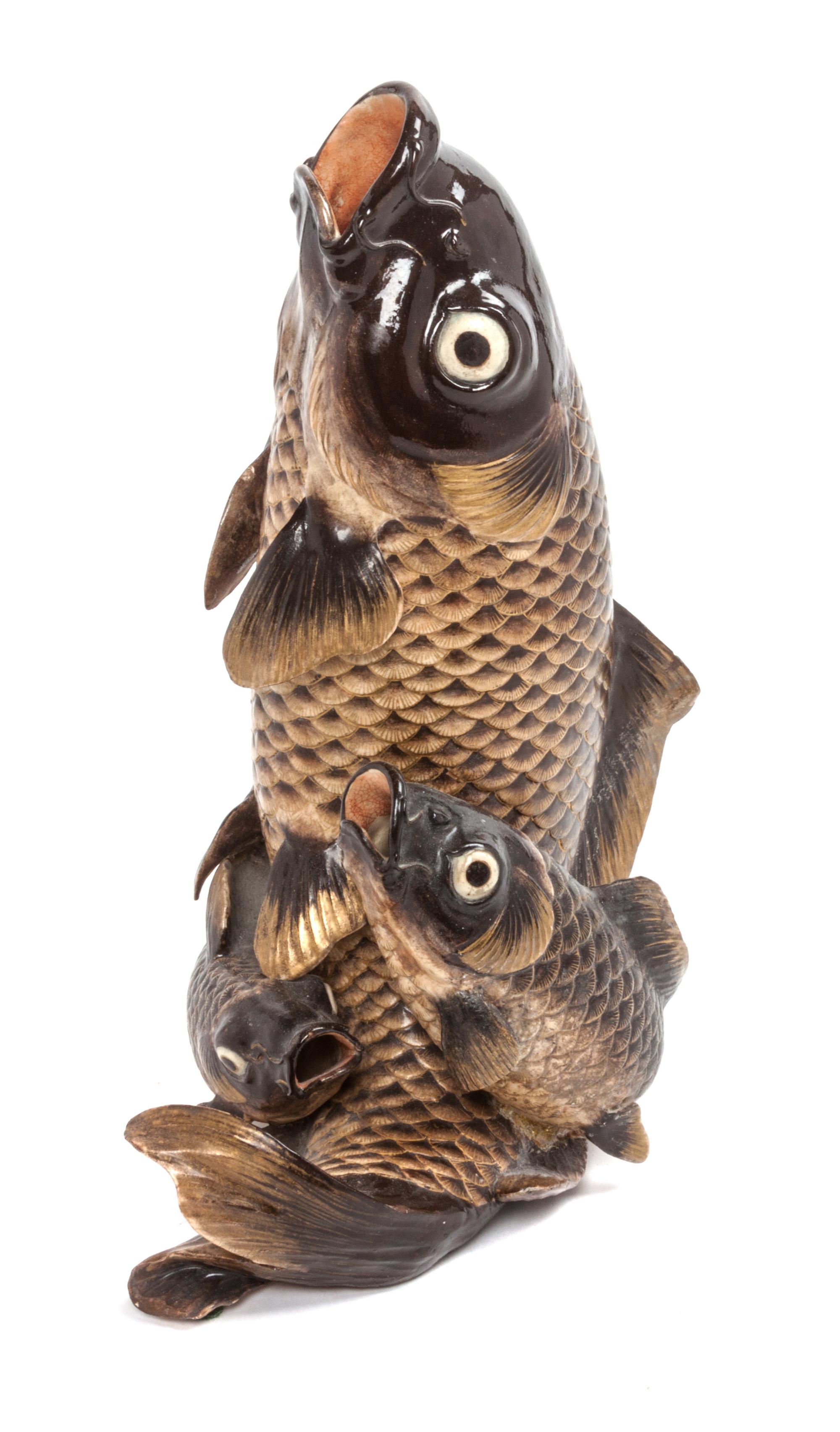 A Japanese Gilt Decorated Black Glazed Pottery Figural Group Height 11 1/2 inches.