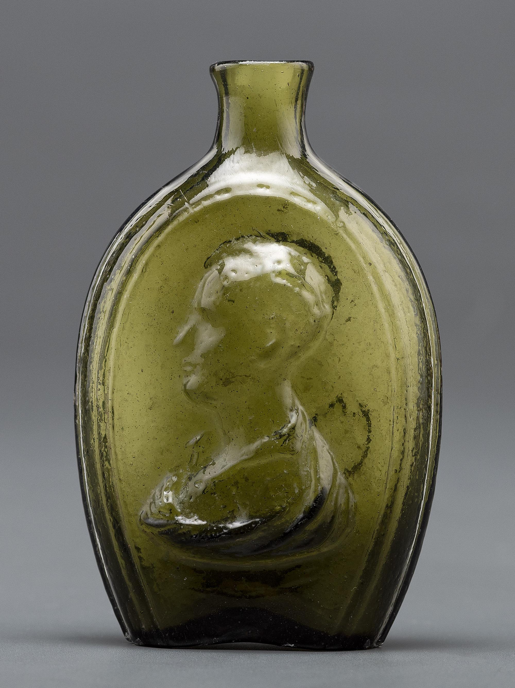An Olive Green Glass Portrait Bust Flask