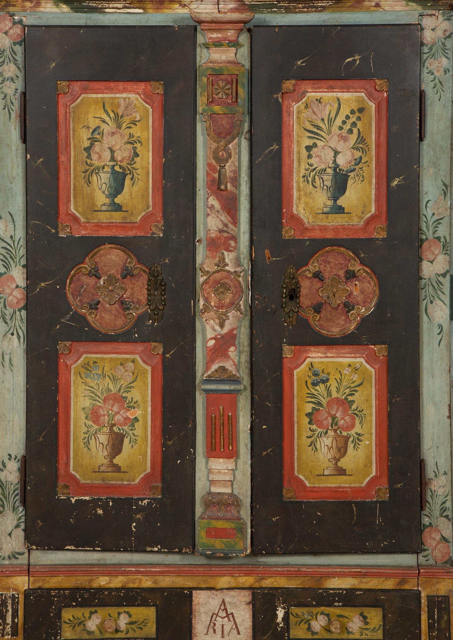 A Continental Carved, Painted and Parcel Gilt Pine Schrank