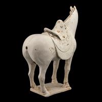 A Chinese Painted Pottery Figure of a Horse