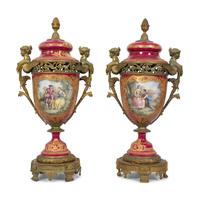 A Pair of Gilt Bronze Mounted Sevres Style Porcelain Covered Urns