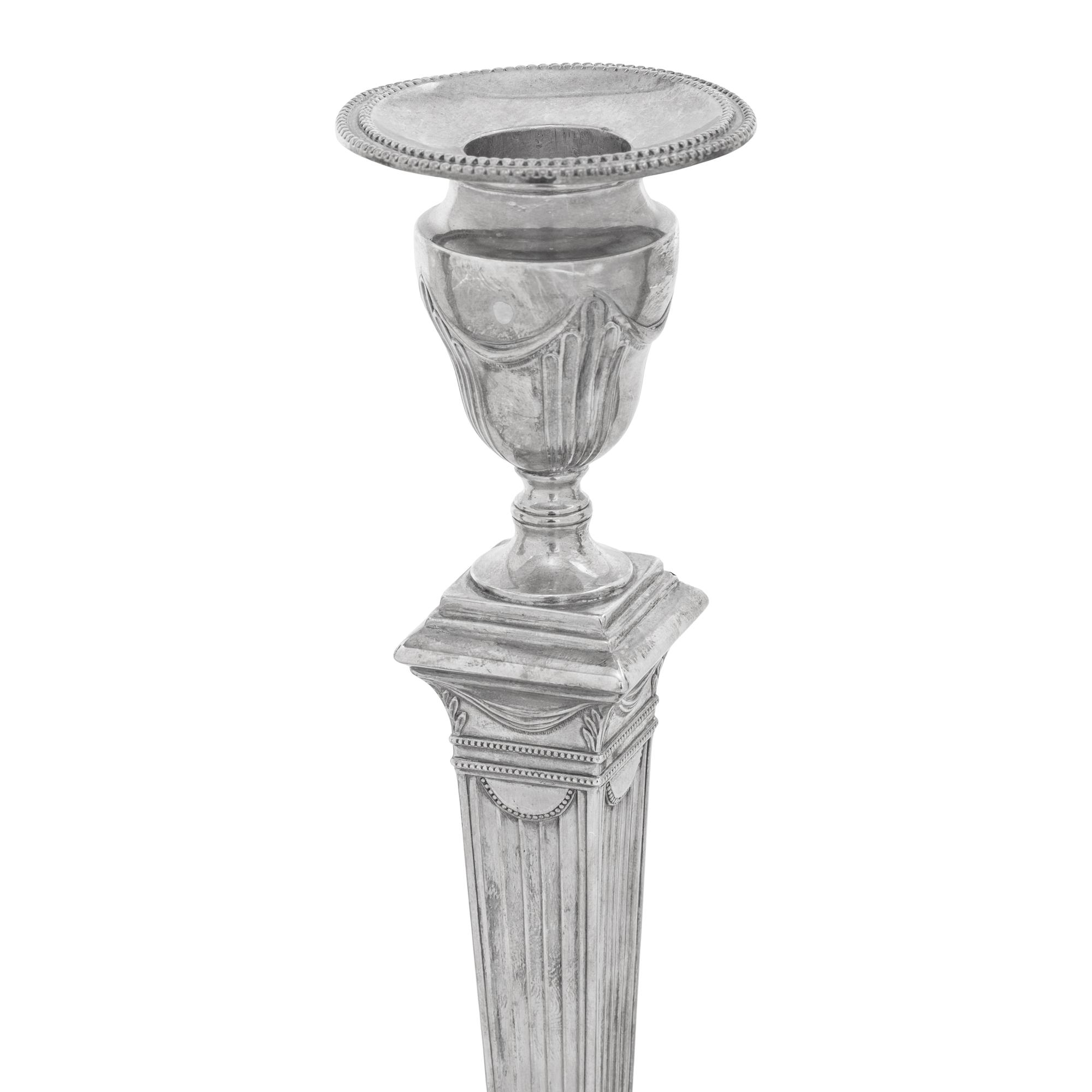 A Set of Four Neoclassical Silver Candlesticks