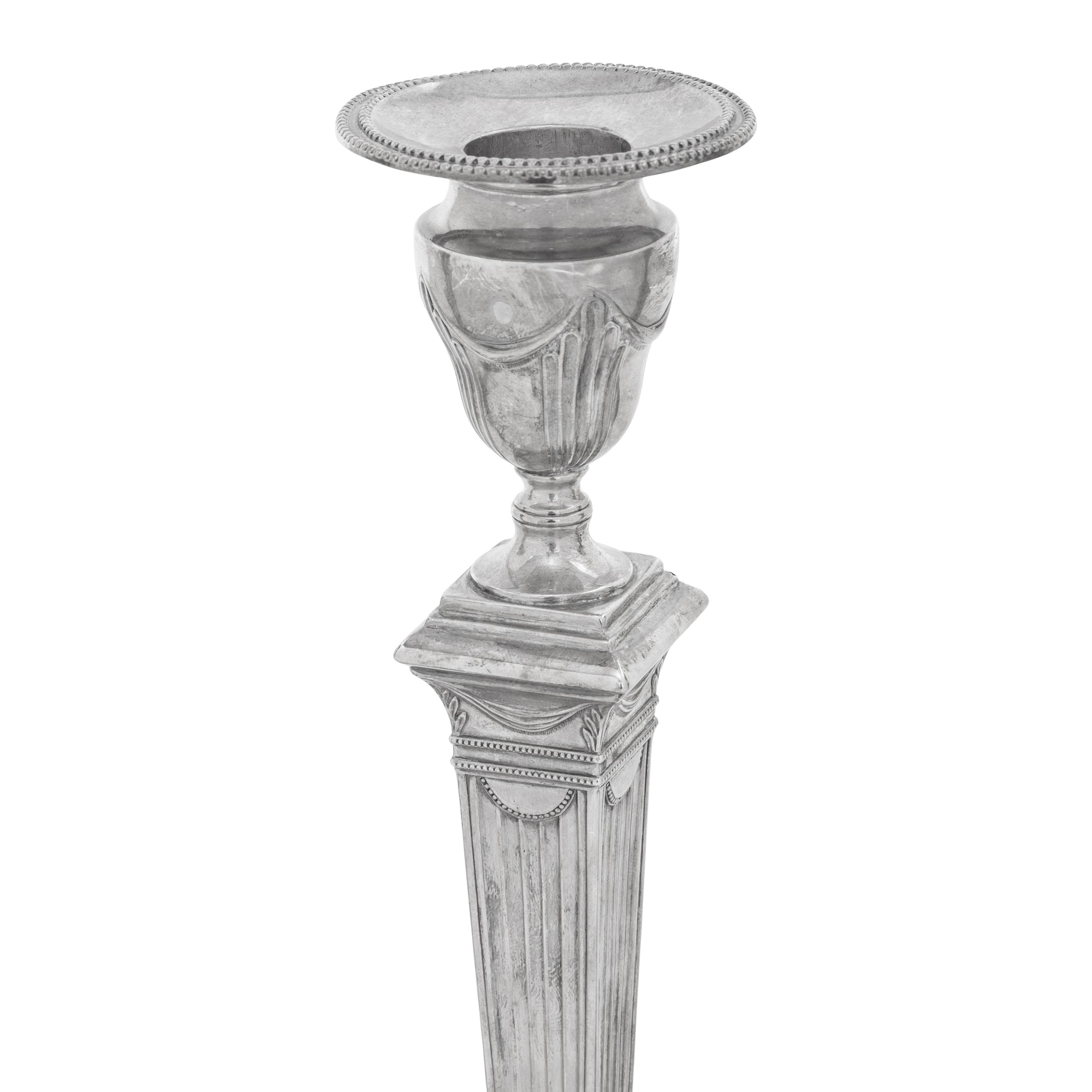 A Set of Four Neoclassical Silver Candlesticks