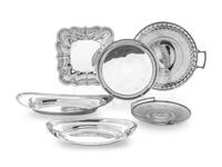 comprising two oval trays, a square platter, a pierced and handled platter, a pierced basket, and a round platter.