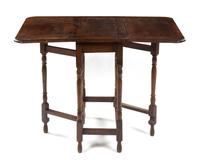 A Provincial Oak Drop-Leaf Table Height 29 x width 25 3/4 x depth 14 inches. — LATE 19TH/EARLY 20TH CENTURY