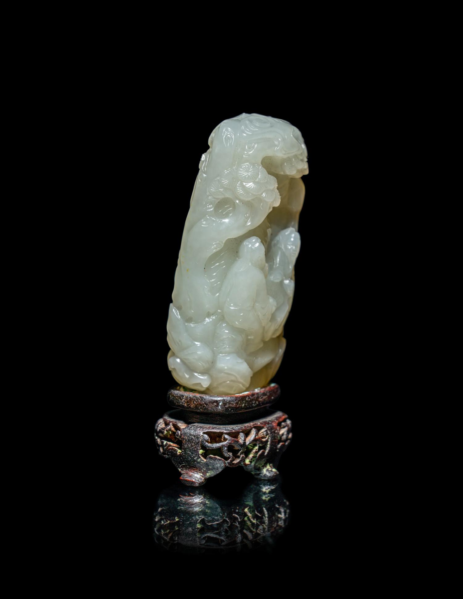 A Chinese White Jade 'Scholars Playing Go' Carving