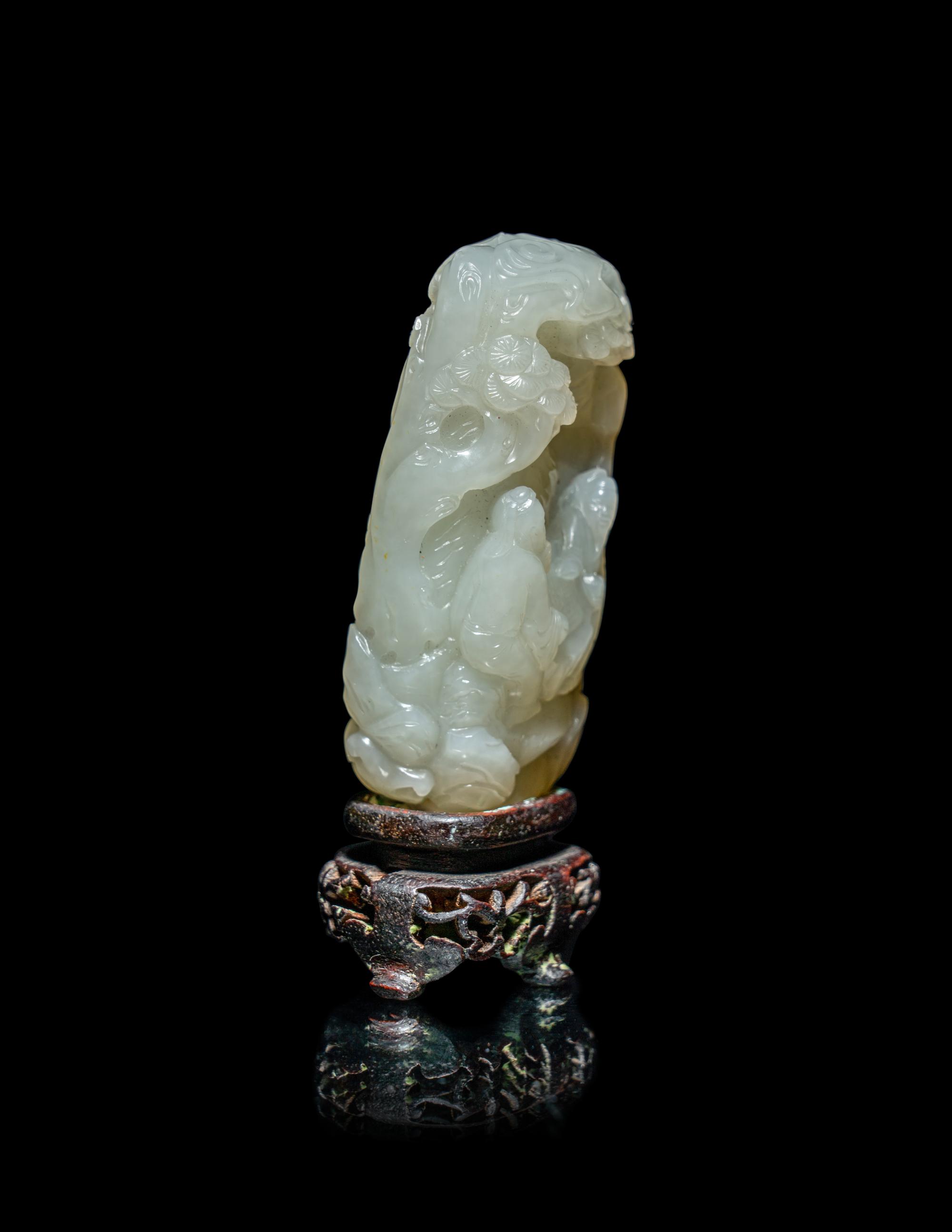 A Chinese White Jade 'Scholars Playing Go' Carving