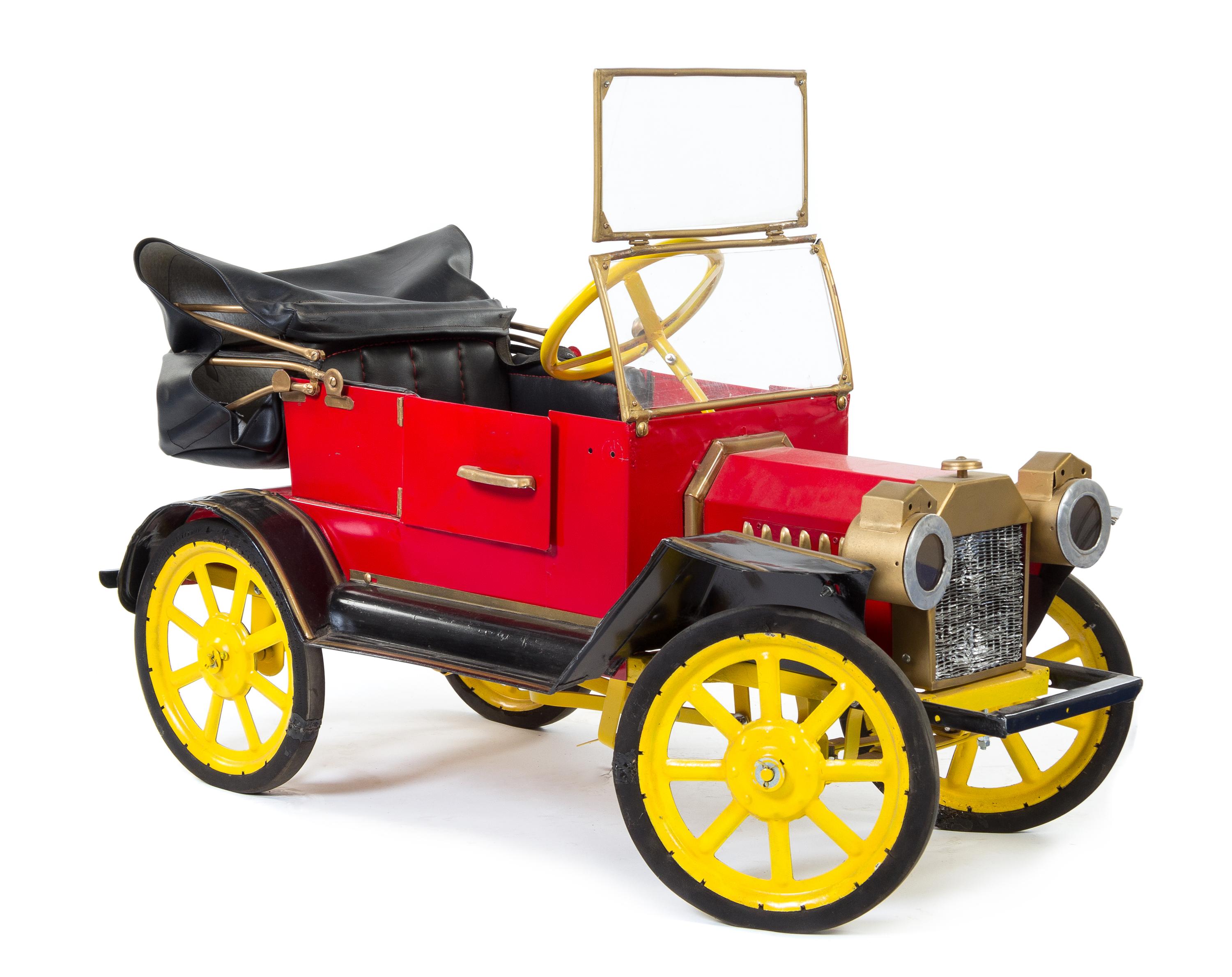 An American Pressed Metal Pedal Car Height 23 x length 40 inches.