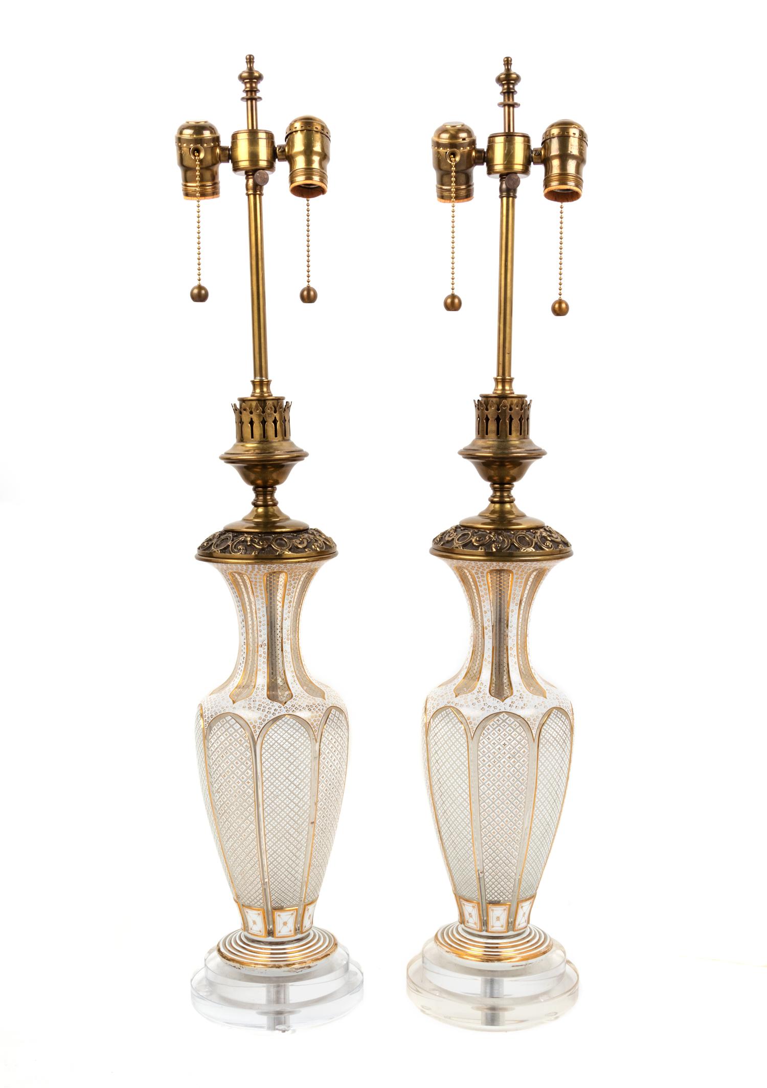A Pair of Bohemian Parcel Gilt and Enamel Decorated Cut Glass Lamps