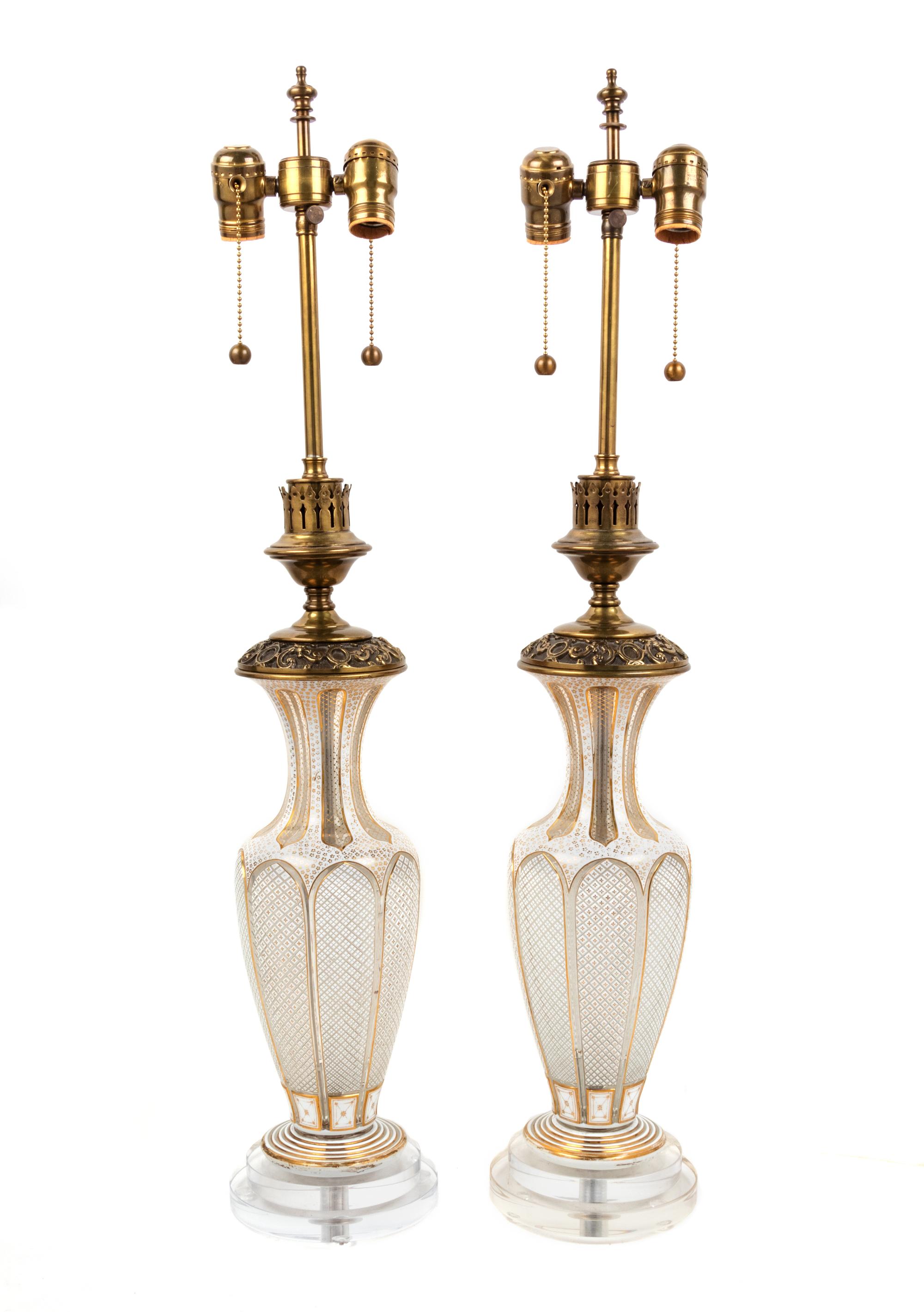 A Pair of Bohemian Parcel Gilt and Enamel Decorated Cut Glass Lamps