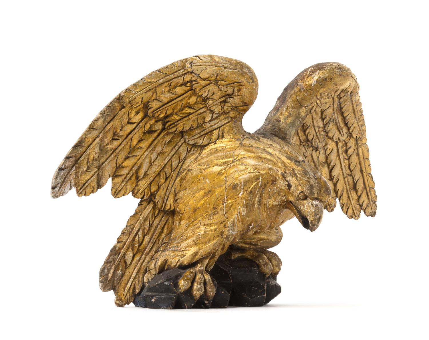 A Carved Giltwood Eagle Applique Height 14 x width 22 inches. — 19TH CENTURY