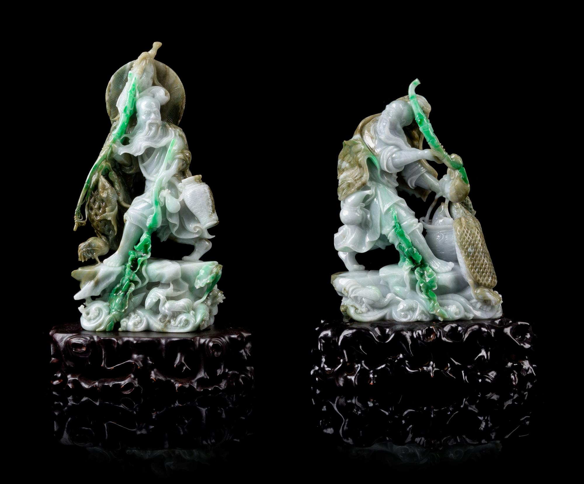 A Pair of Jadeite Figures of Fisherman Immortals Height of wach 10 1/2 inches. — 20TH CENTURY