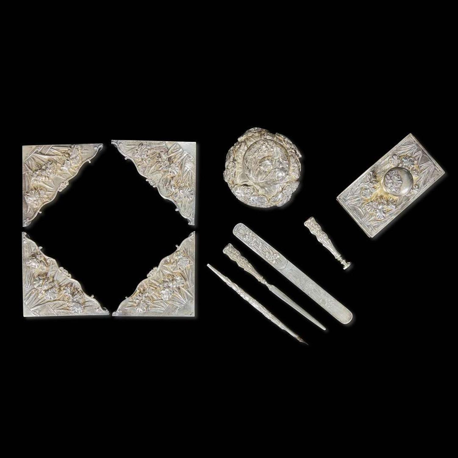 An eight-piece Chinese silver desk set with two added pieces 银质器具一组八件及两附件