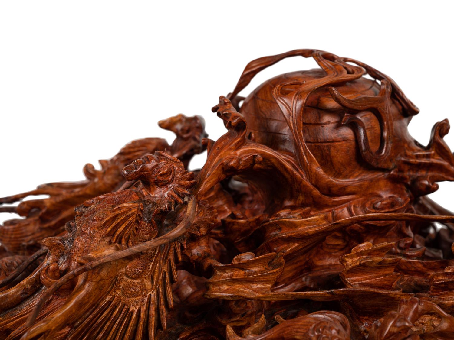 A Large Chinese Carved Rosewood or Mahogany Sculpture