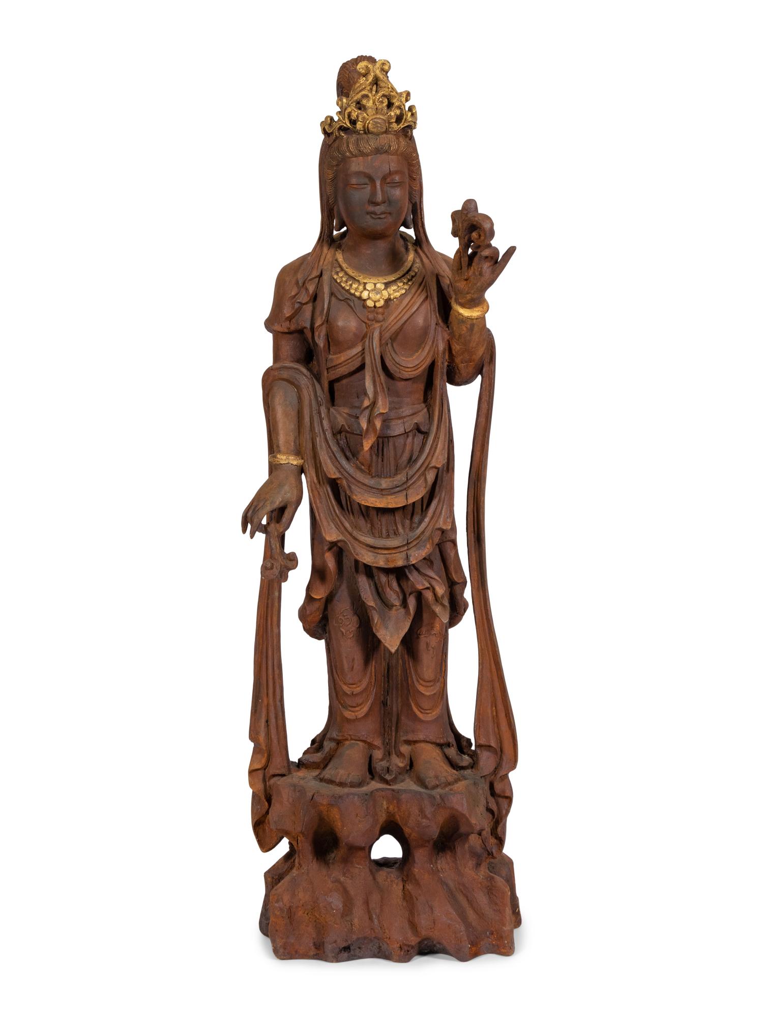 A Carved and Gilt Guanyin Statue