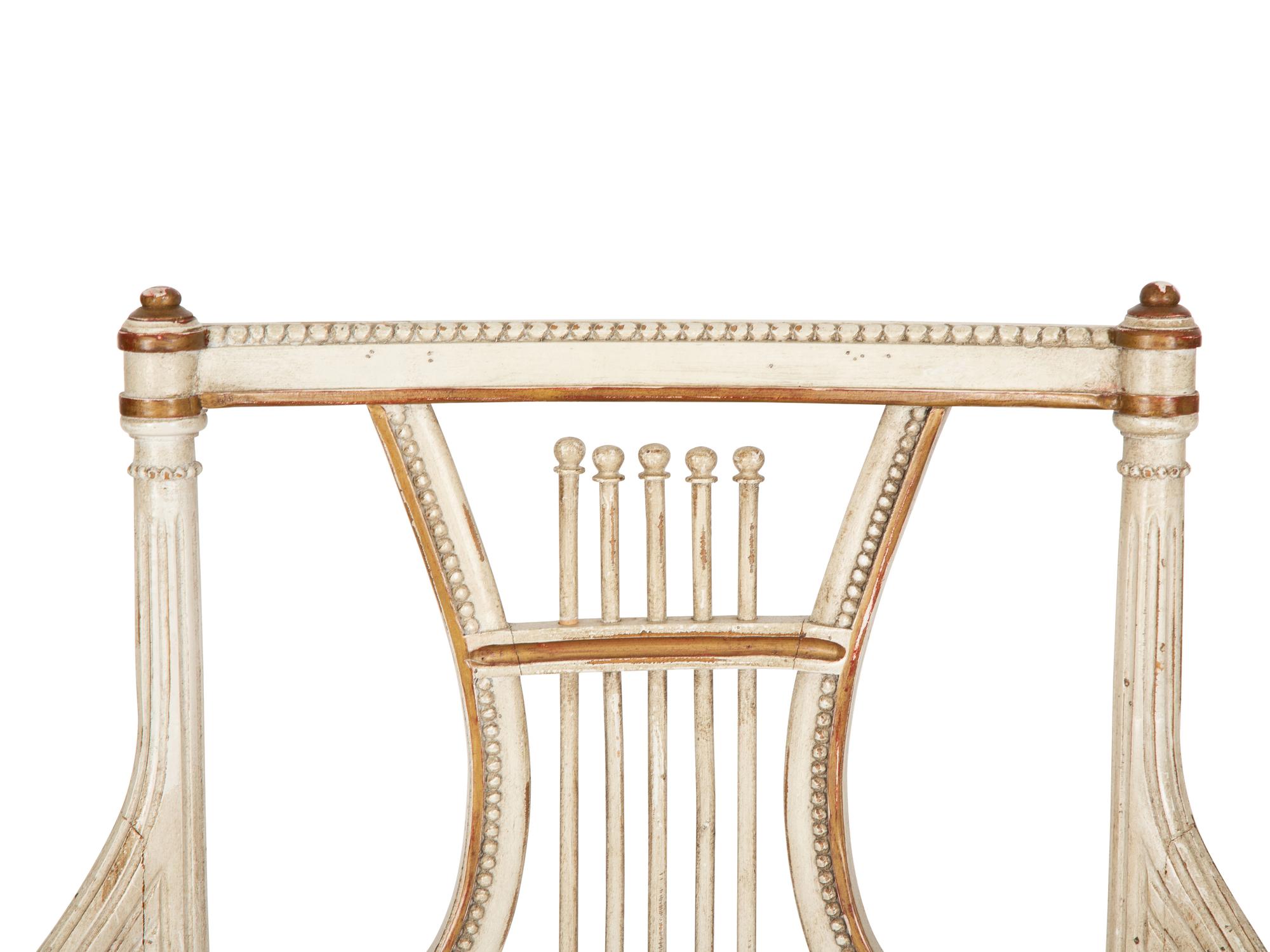 A Continental Painted and Parcel Gilt Fauteuil