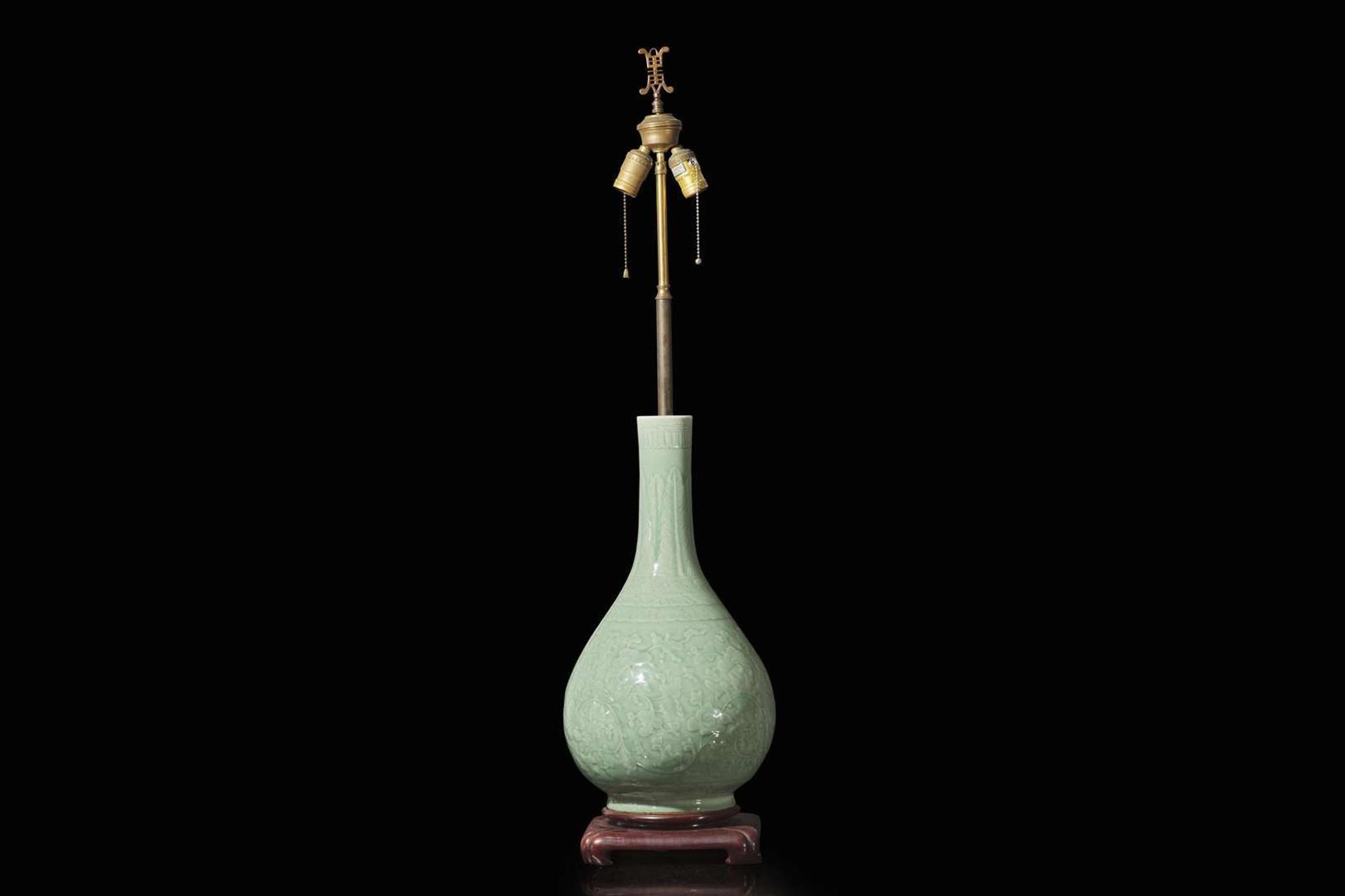 A Chinese carved celadon-glaze porcelain vase, mounted as a lamp 青釉賞瓶改製檯燈