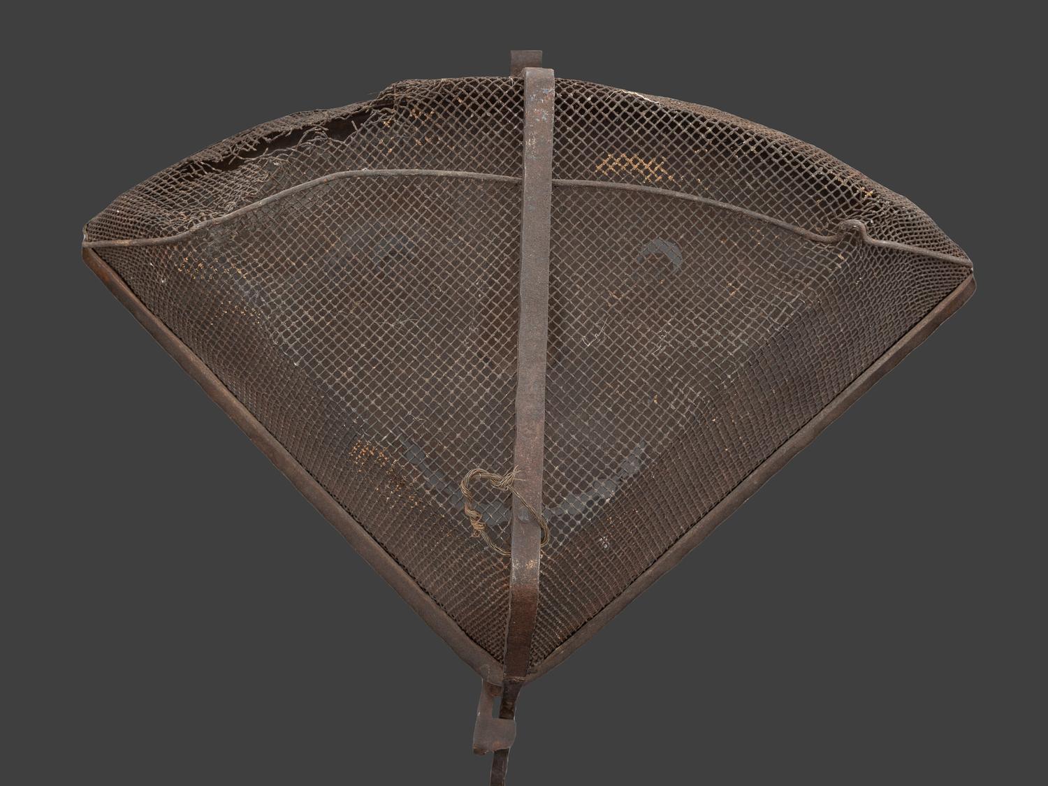 A Forged and Hammered Iron Figural Chestnut Roaster
