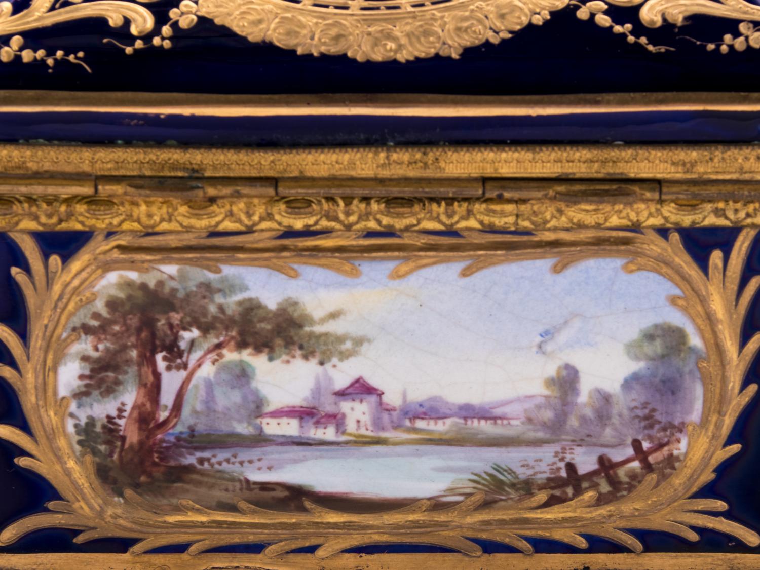 A Sèvres Style Gilt Metal Mounted, Painted and Parcel Gilt Porcelain Table Casket