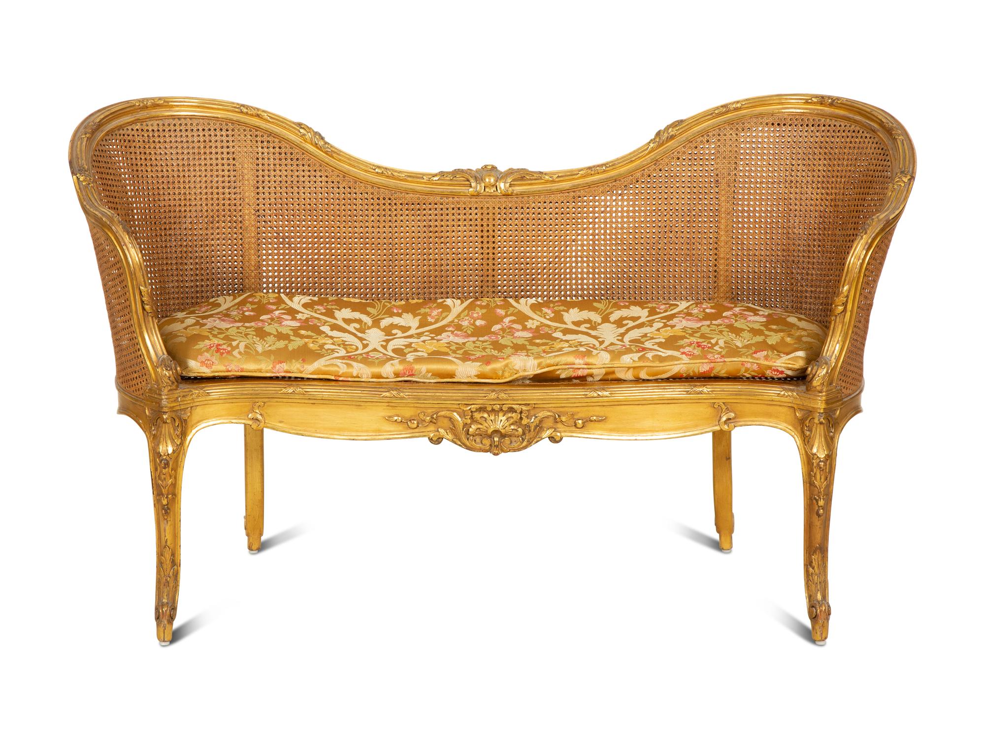 A Louis XV Style Caned Giltwood Settee
