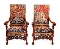 A Pair of Continental Carved Oak Upholstered Chairs