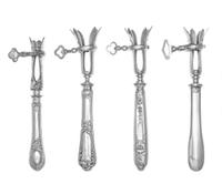 A Group of Three French Silver-Handled Bone Holders, various makers, the handles decorated with ribbon and bellflower motifs, together