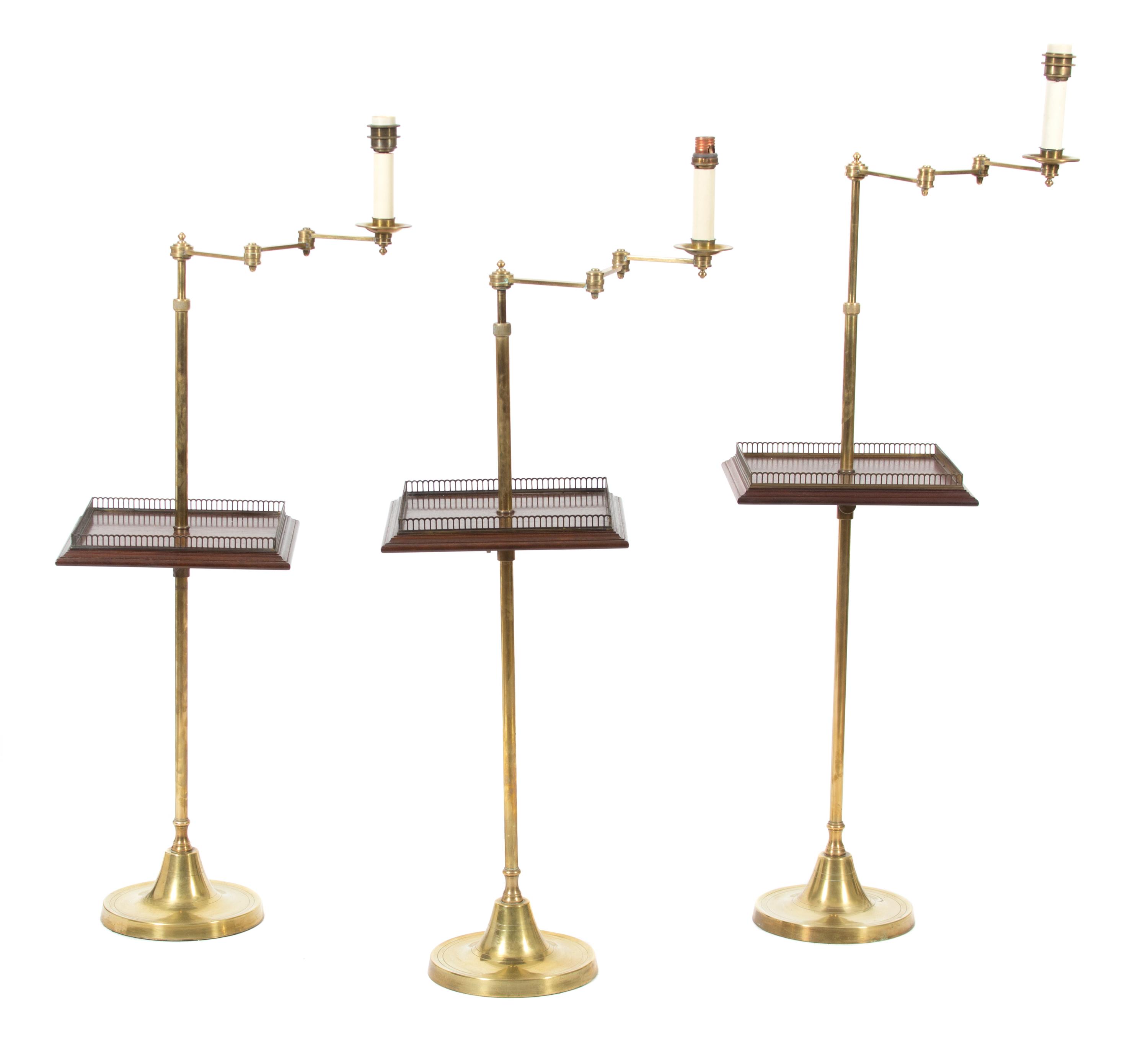 A Collection of Three Vaughan Brass Floor Lamps Height of tallest (to top of candlestick) 50 inches. — 20TH CENTURY