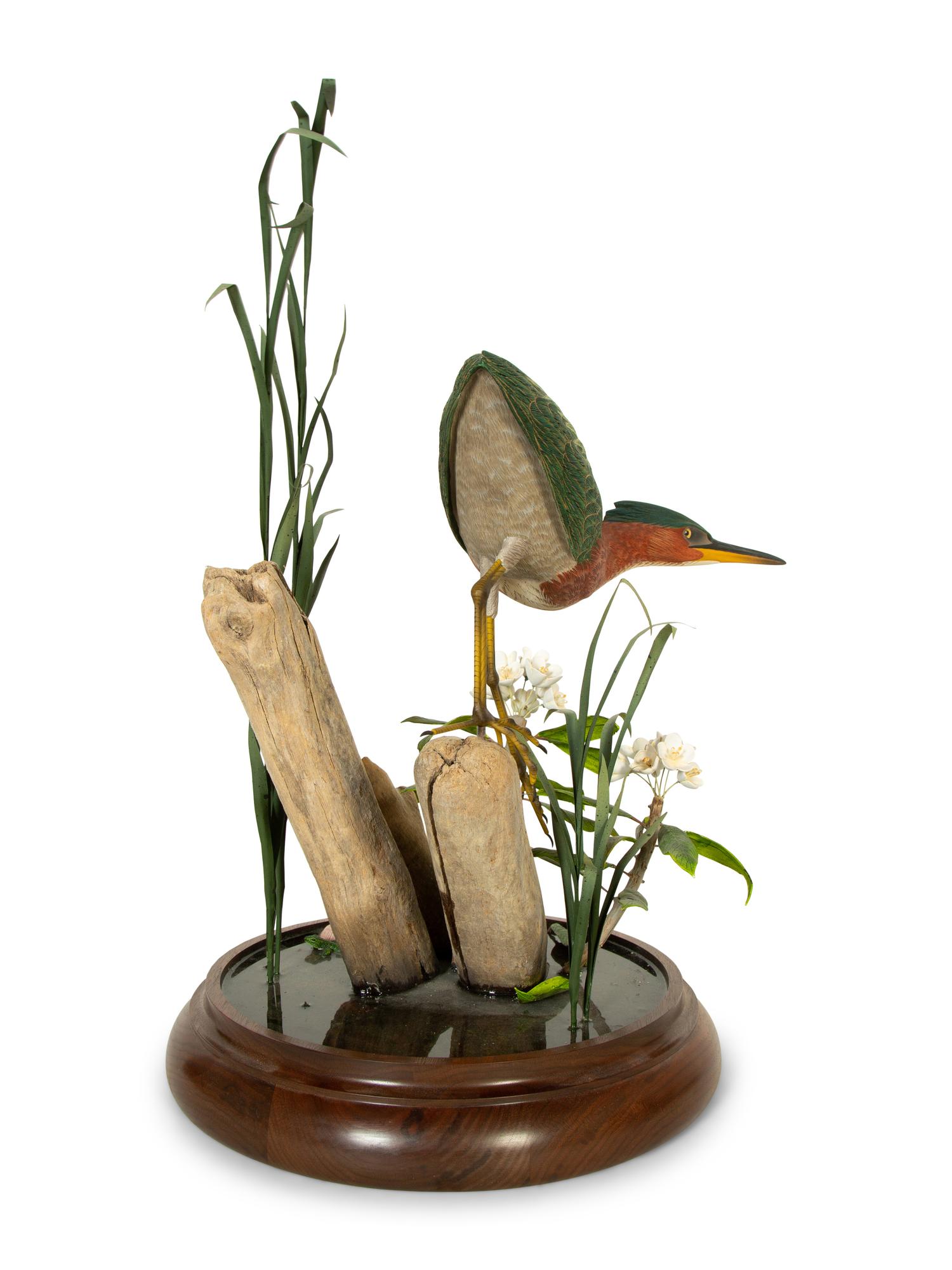 A Carved and Painted Shore Bird in Naturalistic Setting